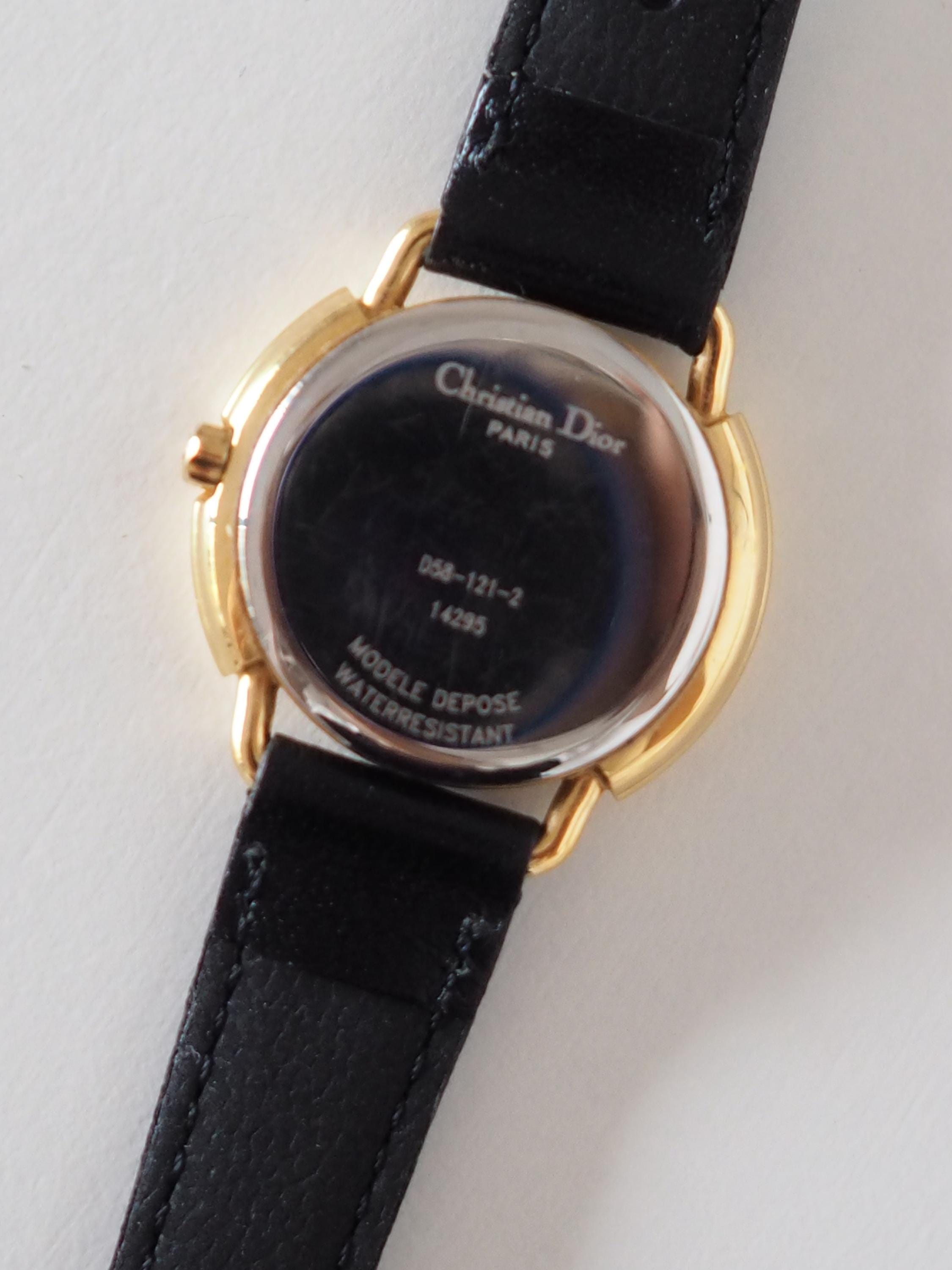 Christian Dior Round Shell Watch Gold Metal Black Leather Quartz Wristwatch Ladies Vintage Authentic